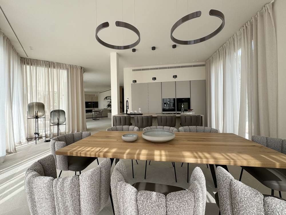 Dining room with sculptural lighting and bespoke furniture