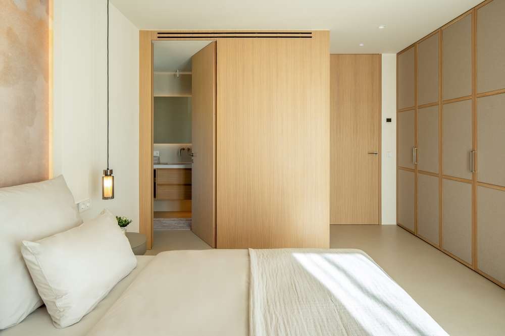 Master suite with warm oak joinery